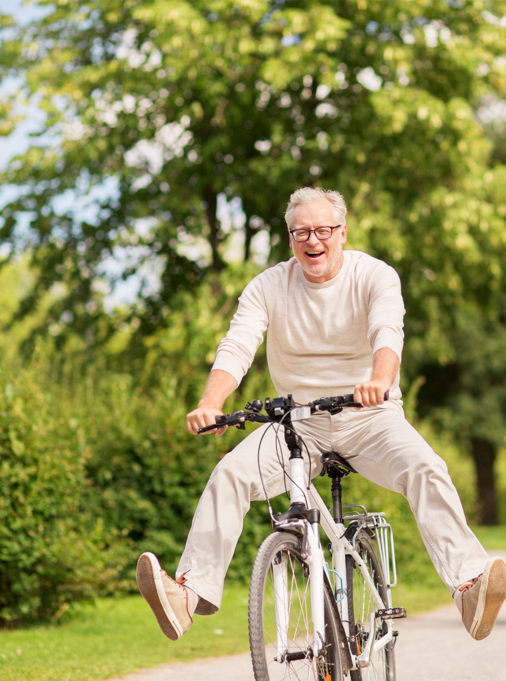happy senior man riding bike